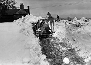 Tracked Gallery: Digger tries to clear a way through, on the road from Pentre Meyrick, to Llantwit Major