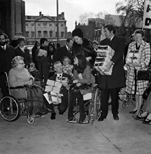 Disabled and blind men and women take a petition to the House of Commons asking for Disabled and blind men and women take a petition to the House of Commons asking for
