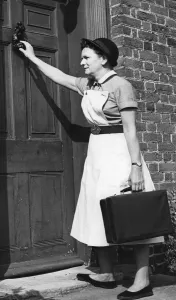 A district nurse paying a visit to a mother. 5th September 1964 A district nurse paying a visit to a mother. 5th September 1964