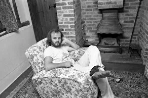 DJ John Peel at home sitting in lounge 1975 John Peel BBC Radio 1'