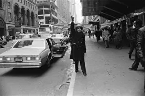 Images Dated 13th February 1981: A doorman hailing a cab in New York, 13th February 1981