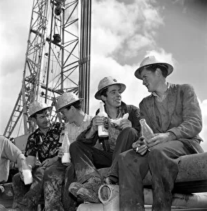 Images Dated 26th December 2007: Drilling for oil in Ireland. Irish workers enjoy a lunch break beneath the rig