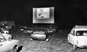 Drive In Cinema, in farmer Swinburne's cow pasture, with silos in the background Drive In Cinema, in farmer Swinburne's cow pasture, with silos in the background