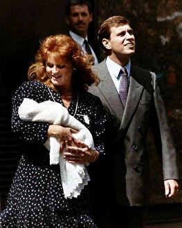 Images Dated 15th August 1988: Duke and Duchess Of York holding Princess Beatrice leaving Hospital