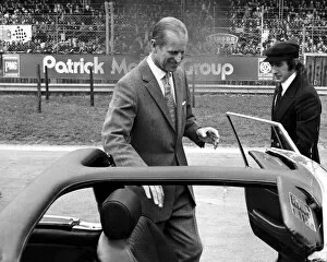Images Dated 14th April 1975: The Duke of Edinburgh. Prince Philip with racing driver Jackie Stewart. April 1975