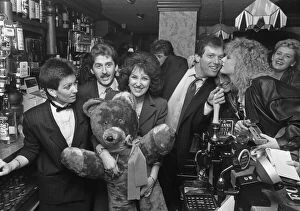 Images Dated 25th November 1985: Eastenders Den and Angie Watts put their weight behind the Charity Snowball raising
