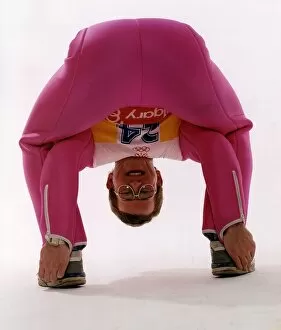 Images Dated 20th February 1992: Eddie Edwards in pink ski clothing bending down and touching his heels