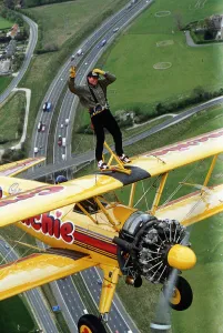 Images Dated 28th April 1992: Eddie Kidd flying above M25 to publisize the Skip Lunch appeal Dbase MSI Glossary