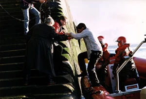 Eddie Kidd being helped off a boat after completing a TV stunt A©Mirrorpix