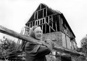 Elderly woman May at work in building her house. July 1978 P009031 Elderly woman May at work in building her house. July 1978 P009031