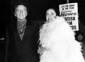 Images Dated 12th November 1975: Elizabeth Taylor and Richard Burton arrive at the Evening News Briitish Film Awards in