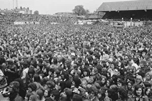 Images Dated 5th May 1974: Elton John fans swarm in to Watfords Vicarage Road ground