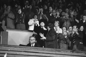 Elton John and fans watching the Watford v Gillingham football match. 11th November 1978 Elton John and fans watching the Watford v Gillingham football match. 11th November 1978