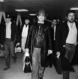 Elton John at Heathrow airport. 7th February 1982