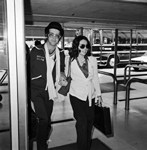 Elton John leaving Heathrow airport hand in hand with Connie Papras Elton John leaving Heathrow airport hand in hand with Connie Papras
