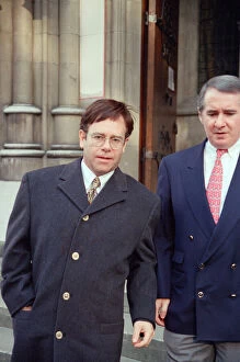 Images Dated 4th November 1993: Elton John and his manager John Reid at the High Court for a Libel Case against