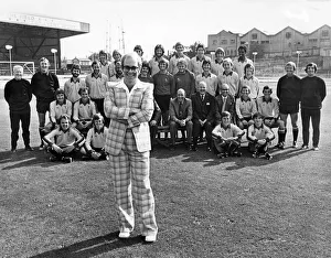Elton John poses with his team of players and staff of Watford Football club Elton John poses with his team of players and staff of Watford Football club