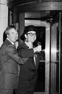 Elton John presents Watford FC's new manager, Dave Bassett, at a London reception Elton John presents Watford FC's new manager, Dave Bassett, at a London reception