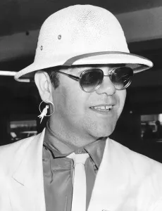Elton John singer arriving at Heathrow from Sun City, South Africa August 1983 Elton John singer arriving at Heathrow from Sun City, South Africa August 1983