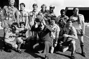Images Dated 14th May 1983: Elton John and the Watford side pose for the photographers after their match against