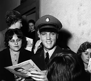 Elvis Presley signs autographs at press conference March 1960 for fans in Germany Elvis Presley signs autographs at press conference March 1960 for fans in Germany