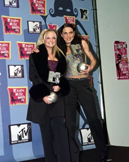 Emma Bunton and Mel C of all girl pop group The Spice Girls holding their awards at Emma Bunton and Mel C of all girl pop group The Spice Girls holding their awards at