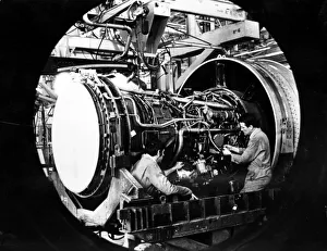Engineers work on a Pratt and Whitney jet engine from Boeing 747 at Nantgarw Engineers work on a Pratt and Whitney jet engine from Boeing 747 at Nantgarw