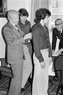 Images Dated 15th April 1975: England Football Squad: Liverpool star Kevin Keegan being measured for his new suit with
