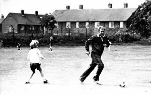 Images Dated 23rd July 1980: Former England footballer Bobby Moore coaches children at the Coral sponsored Bobby Moore