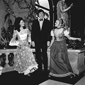 Images Dated 25th March 1971: England goalkeeper Gordon Banks wearing a tuxedo and bow tie as he stands with two girls