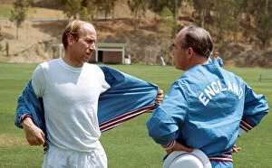 Images Dated 8th May 1970: England manager Alf Ramsey talks with Bobby Charlton during a training session with