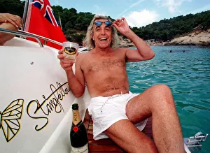 English nightclub owner Peter Stringfellow enjoys a glass of Moet English nightclub owner Peter Stringfellow enjoys a glass of Moet