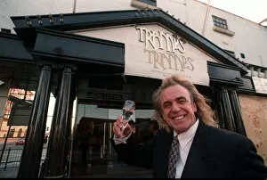Images Dated 27th November 1995: English nightclub owner Peter Stringfellow posing with a glass of champagne outside