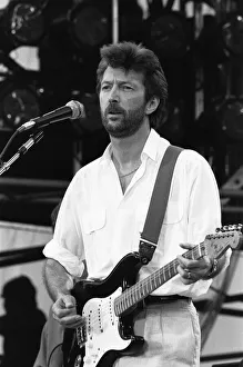 Eric Clapton performing on stage at the John F. Kennedy Stadium, Philadelphia Eric Clapton performing on stage at the John F. Kennedy Stadium, Philadelphia