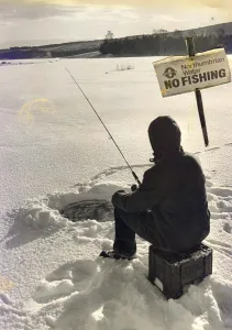 00054 Gallery: Eskimo style fishing in this winter wonderland at Kielder when the lake froze over in