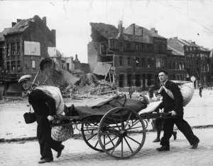 Louvain Gallery: Evacuating a sick man on a wheeled stretcher through Louvain, Belgium
