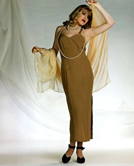 Images Dated 18th November 1993: Evening dress Veronica Lake type glamour Split gold dress, black shoes