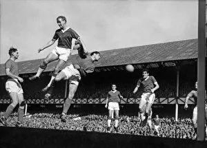 Everton footballer Alex Young and Ipswich goalkeeper Hall go up for a corner kick Everton footballer Alex Young and Ipswich goalkeeper Hall go up for a corner kick