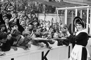 Supporters And Spectators Gallery: Everton toffee lady, 16 year old Catherine Dunn, holds a trophy presented to Everton