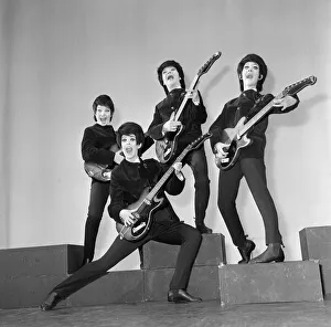 Everybody wants to get into the act. Even girls. The four Beatle-browed birds in Everybody wants to get into the act. Even girls. The four Beatle-browed birds in