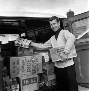 Ex Blackburn and England winger Bryan Douglas loading his grocery van ready for a day Ex Blackburn and England winger Bryan Douglas loading his grocery van ready for a day