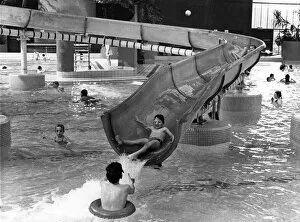 Images Dated 3rd January 1989: Families enjoying the water slide at Temple Park Leisure Centre in South Tyneside