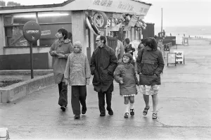 East Yorkshire Gallery: A family making the most of a walk on Hornsea sea front despite the weather conditions