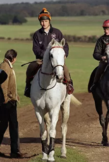 Famous racehorse Desert Orchid being taken out for a training session with jockey Richard