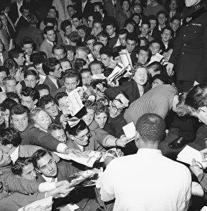Fans rush forward to get the autograph of jazz legend Lionel Hampton at the Empress Hall Fans rush forward to get the autograph of jazz legend Lionel Hampton at the Empress Hall