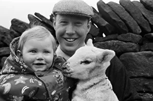 Images Dated 20th April 1992: Farmer Robert Nobles and his son James with one of the spring lambs on their farm at