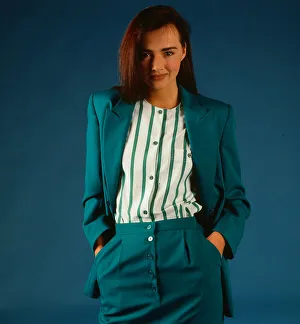 Fashion female suits 1988 Model wearing turquoise suit Fashion female suits 1988 Model wearing turquoise suit