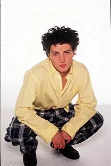 Images Dated 19th July 1996: Fashion - Model Kate Moss brother Nick crouching wearing tartan style trousers