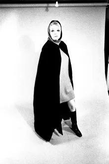 Images Dated 13th April 1970: A fashion shoot from 13 April 1970 - A model wears a cloak and knee lenght boots