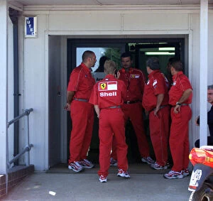 Images Dated 12th July 1999: Ferrari team members rush to the medical centre for news on Michael Schumacher